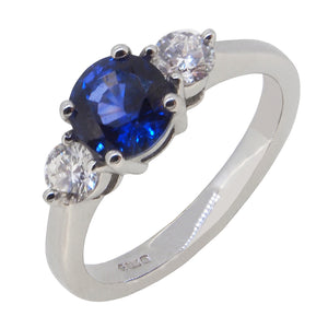 A modern, 18ct white gold, sapphire & diamond set, three stone ring