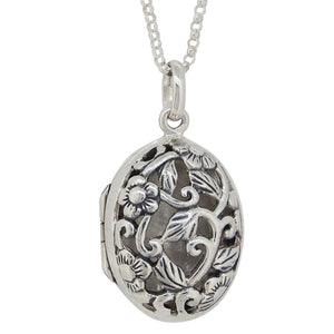 A modern, silver, oval locket with a pierced front & chain