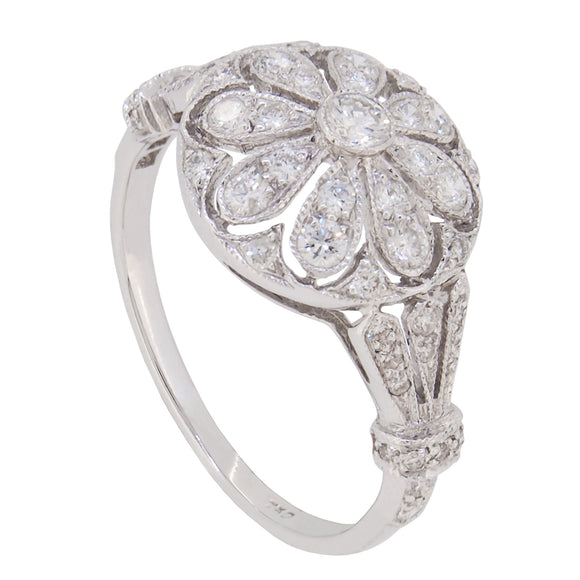 A modern, 18ct white gold, diamond set cluster ring