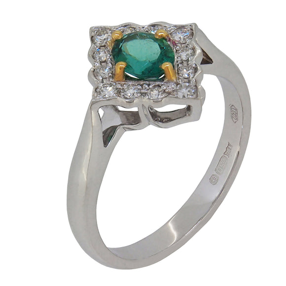 A modern, 18ct white gold, emerald & diamond set cluster ring