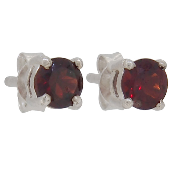 A pair of modern, silver, garnet set stud earrings