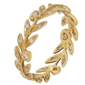 A modern, 18ct yellow gold, diamond set, leaf pattern band ring