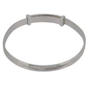 A modern, silver, child's expanding bangle