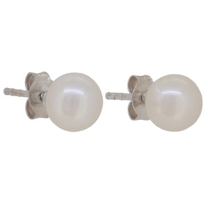 A pair of modern, silver, pearl set stud earrings