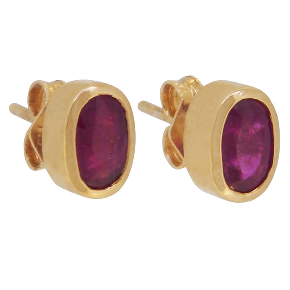 A pair of modern, 18ct yellow gold, ruby set stud earrings