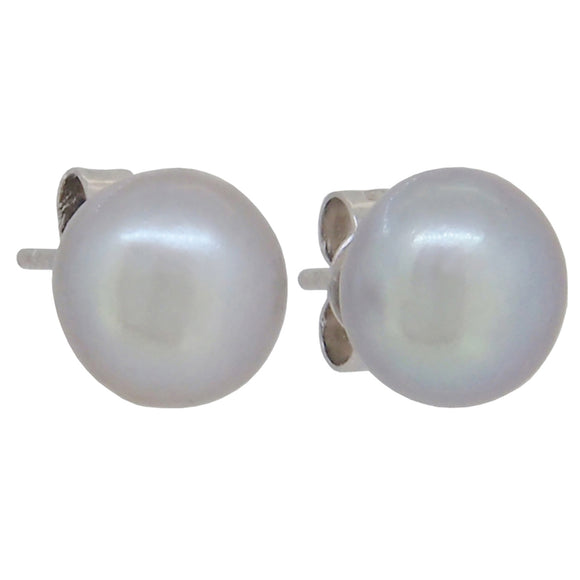 A pair of modern, silver pearl set button stud earrings