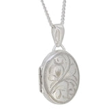 A modern, silver, engraved, oval locket & chain