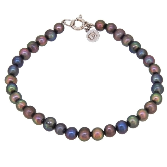 A modern, silver, peacock button pearl set bracelet