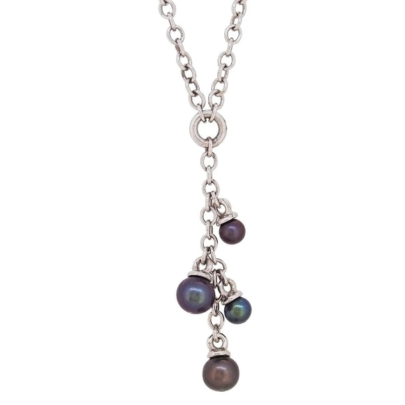 A modern, 9ct white gold, pearl set, four stone necklace