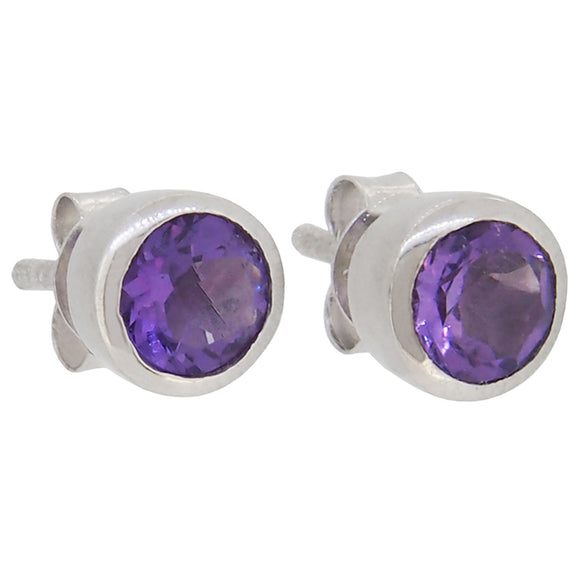 A pair of modern, silver, amethyst set stud earrings