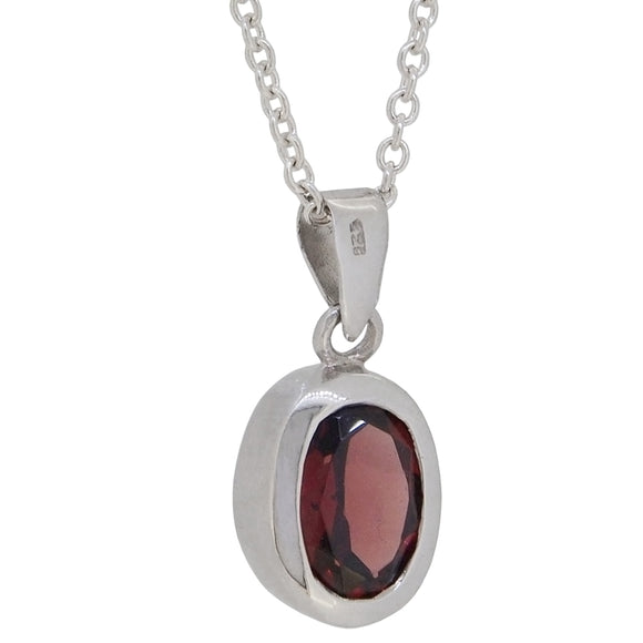 A modern, silver, garnet set pendant & chain.