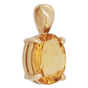 A modern, 9ct yellow gold, multi-facetted citrine set pendant