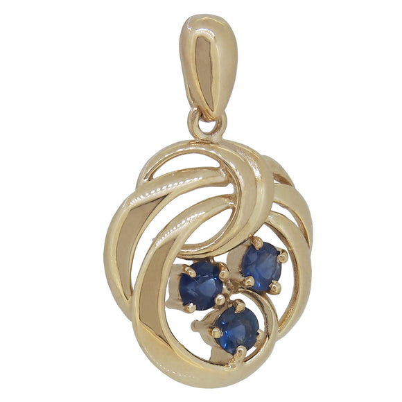 A modern, 9ct yellow gold, sapphire set pendant