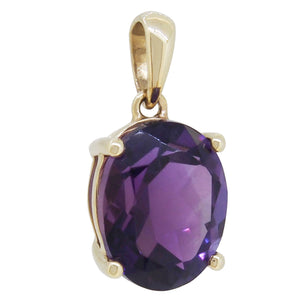 A modern, 9ct yellow gold, amethyst set pendant