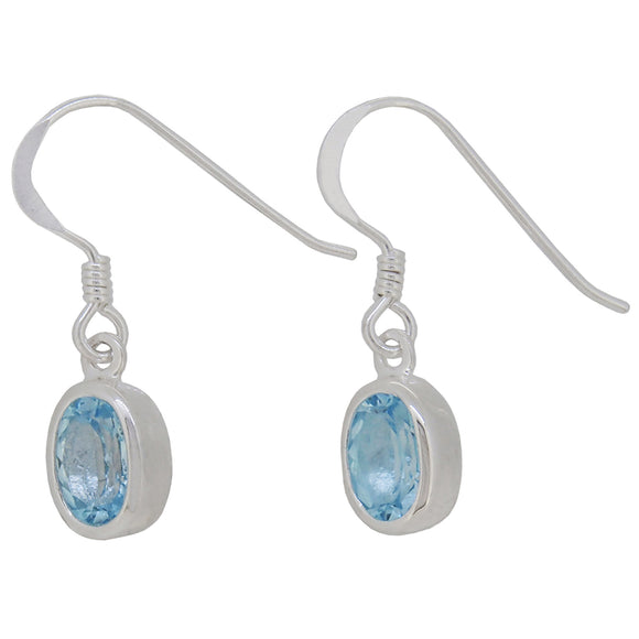 A pair of modern, silver, blue topaz set drop earrings