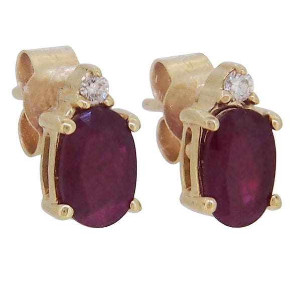 A pair of modern, 9ct yellow gold, ruby & diamond set stud earrings