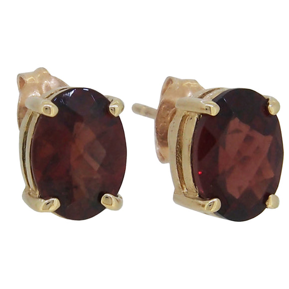 A pair of 9ct yellow gold, garnet set stud earrings