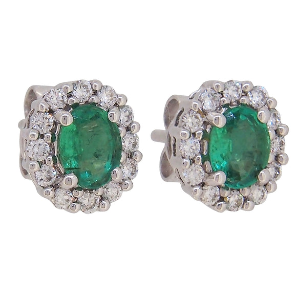 A pair of modern, 18ct white gold, emerald & diamond set stud earrings