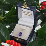 A modern, 9ct white gold, amethyst & diamond set pendant.