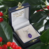 A modern, 9ct white gold, amethyst & diamond set pendant.