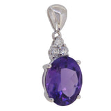 A modern, 9ct white gold, amethyst & diamond set pendant