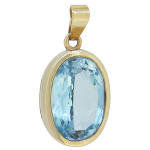 A modern, 9ct yellow gold, blue topaz set pendant