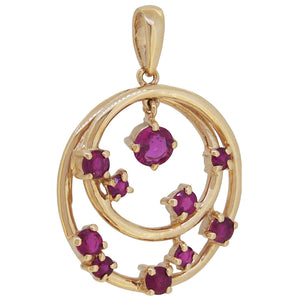 A modern, 9ct yellow gold, ruby set pendant