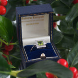 A modern, platinum, peridot & diamond set, square, Art Deco style cluster ring.