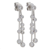 A pair of modern, 18ct white gold, diamond set drop earrings