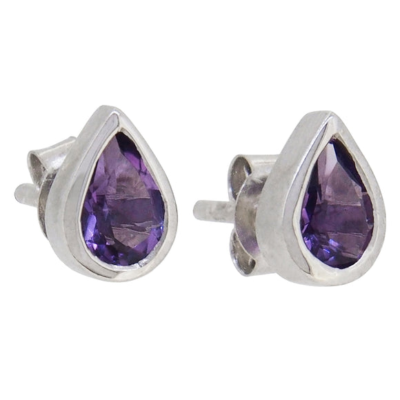 A pair of modern, silver, amethyst set stud earrings