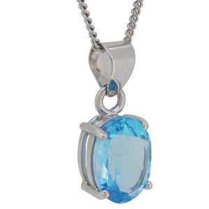 A modern, silver, blue topaz set pendant & chain