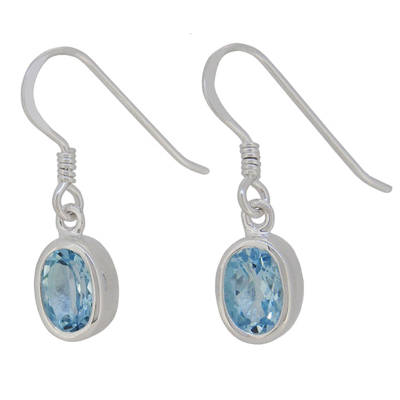 A pair of modern, silver, blue topaz set drop earrings.