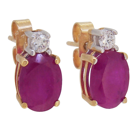A pair of modern, 9ct yellow gold, ruby & diamond set stud earrings