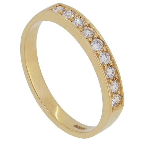 A modern, 18ct yellow gold, diamond set half eternity ring.