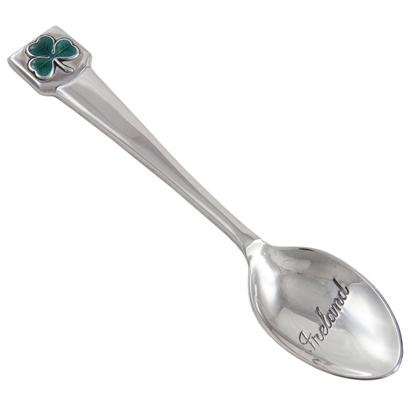 A modern, silver, Ireland souvenir spoon with an enamel set shamrock on the terminal end & Ireland engraved in the bowl