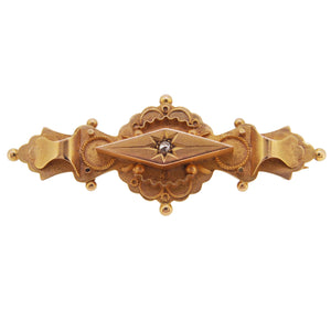 An Edwardian, 9ct yellow gold, diamond set bar brooch