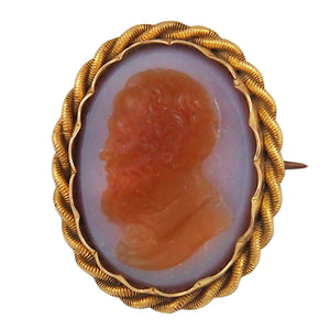 A Victorian, yellow gold cameo brooch featuring the profile of a Gentleman