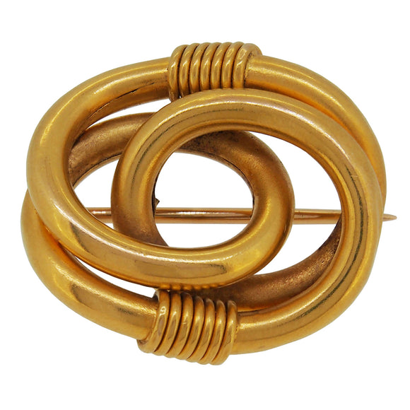An early 20th century, 9ct yellow gold, oval knot brooch