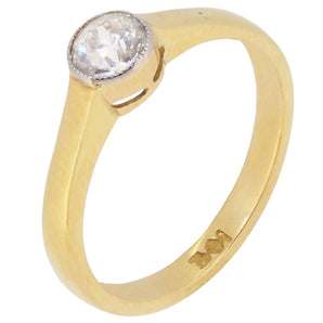A mid-20th century, yellow metal, diamond set, single stone, solitaire ring.