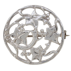 A Victorian, silver, circular, ivy leaf brooch