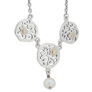 A modern, silver, diamond & pearl set necklet
