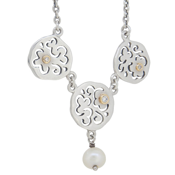 A modern, silver, diamond & pearl set necklet