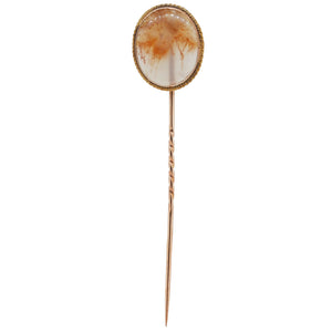 An Edwardian, yellow gold, moss agate set stick pin