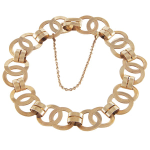 A modern, 9ct yellow gold, flat circular & oval link bracelet