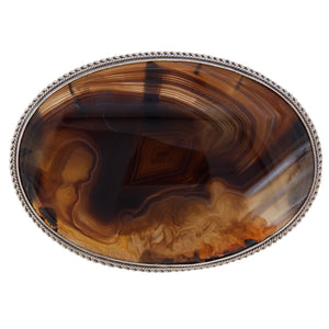 A modern, silver, brown agate set oval brooch