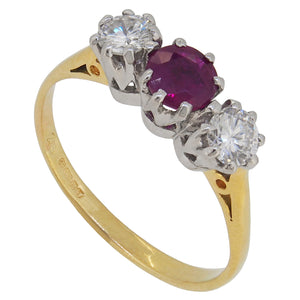 A modern, 18ct yellow & white gold, ruby & diamond set, three stone ring