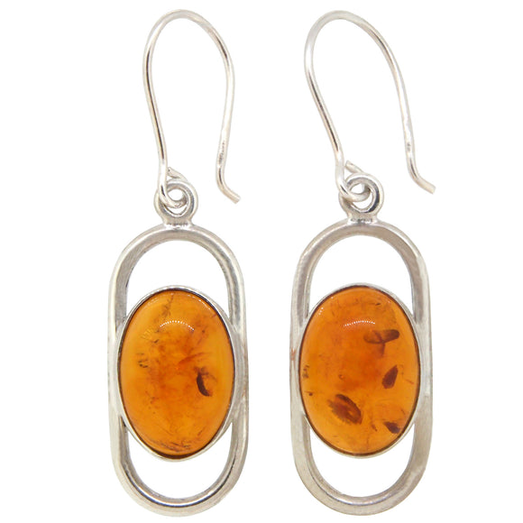 A pair of modern, silver, amber set drop earrings