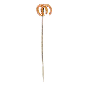 An early 20th century, 9ct yellow gold, double horseshoe stick pin