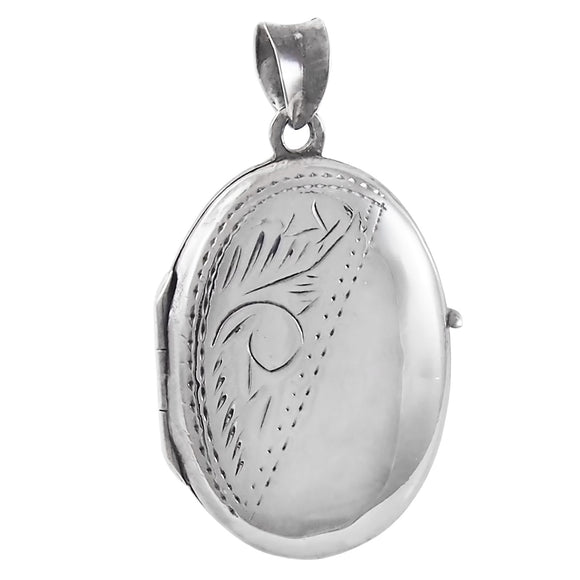 A mid-20th century, silver, half engraved, oval locket