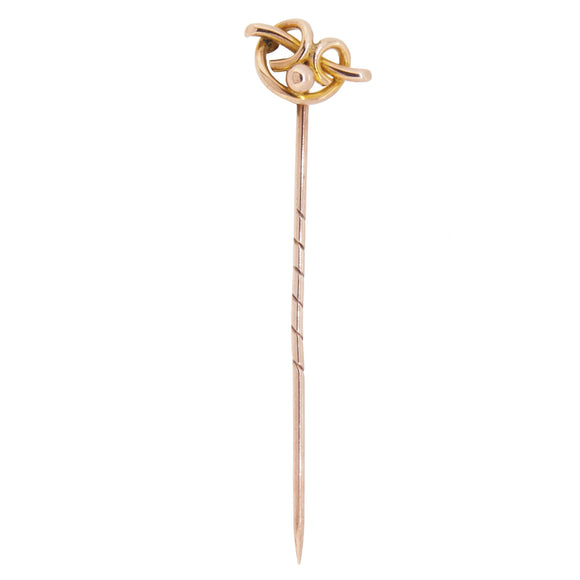 An early 20th century, 9ct rose gold, knot stick pin